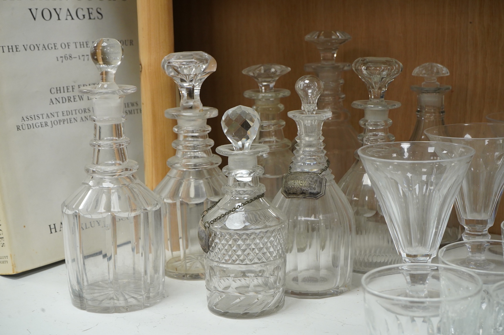 A collection of 19th century and later glassware, to include: Three fluted wine glasses two rummers, various risers and finger bows, decanters etc